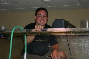 Steven standing inside a 500 gallon tank