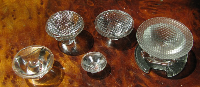 A small assortment of different LED lenses, some of which are using different types of diffusers.