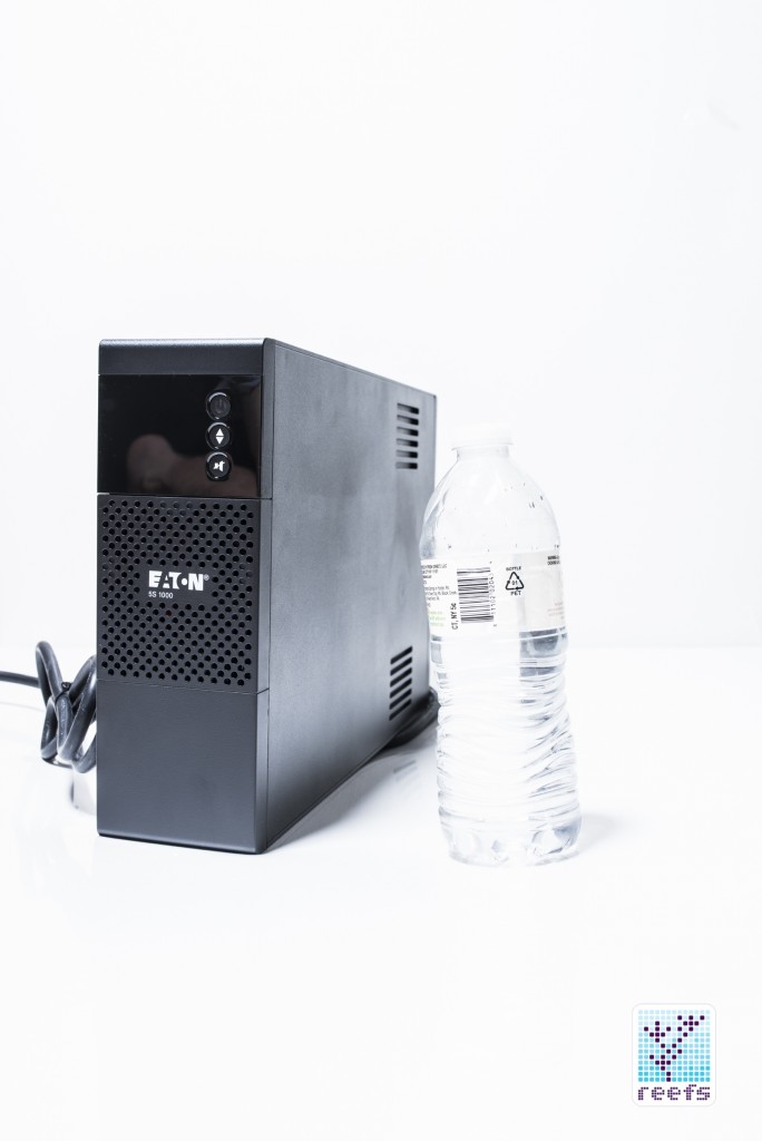 Eaton 5S 1000 UPS next to a 0.5 liter water bottle
