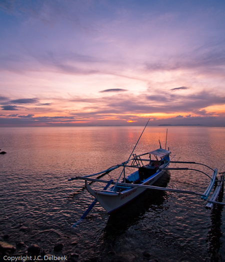 A banka awaits the dawn of a new day in the Philippines. Photo by J. C. Delbeek.